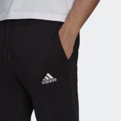 ADIDAS MEN'S SMALL LOGO TRACK PANT 11 ADIDAS MEN'S SMALL LOGO TRACK PANT -Fitness Gear Store GK9268 on model detail 1 transparent 2000x2000 0863a104 74a6 4a99 b0e9 89cc3753d654